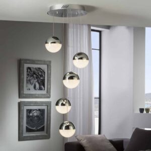 image shows a multi drop pendant with five lights hanging in a grey room